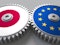 Flags of Japan and the European Union on meshing gears