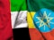 United Arab Emirates and Ethiopia flag on cloth texture