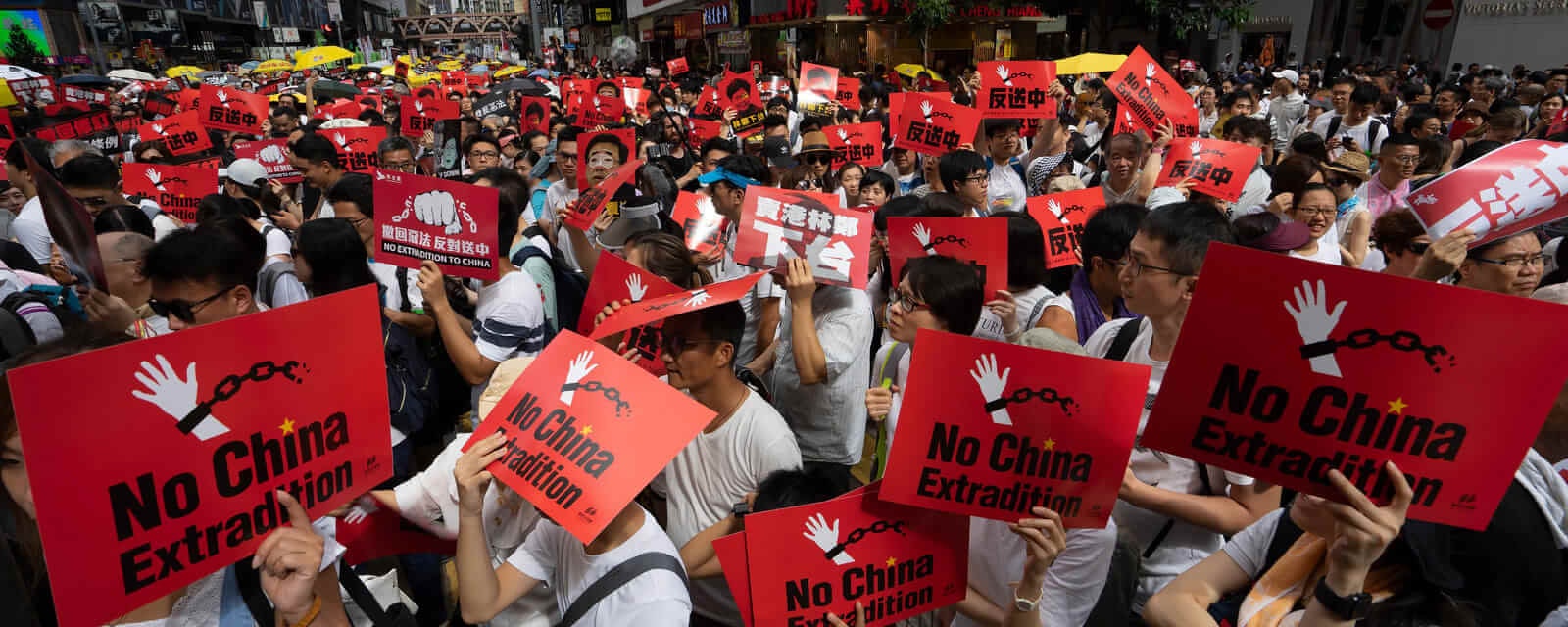 Protesters in China holding signs