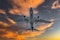 Airplane,In,The,Sky,At,Sunrise,Or,Sunset.,Flight,Travel