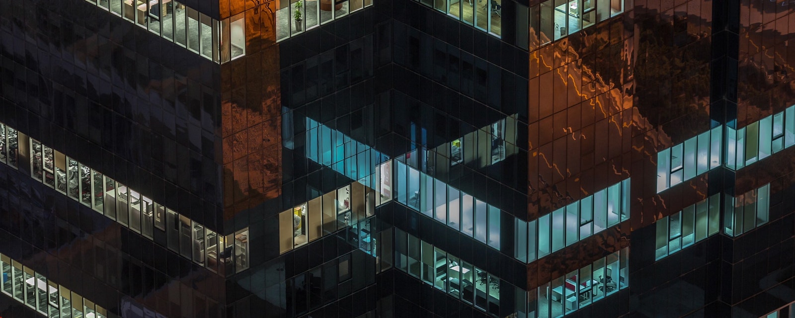 Windows,In,High-rise,Office,Building,In,The,Late,Evening,With